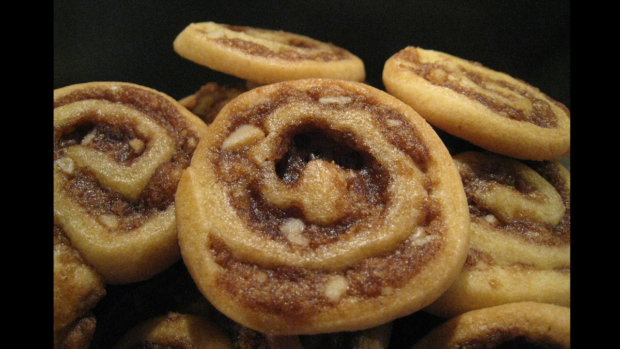 Close-up of cinnamon swirl cookies with a golden-brown crust and rich cinnamon filling