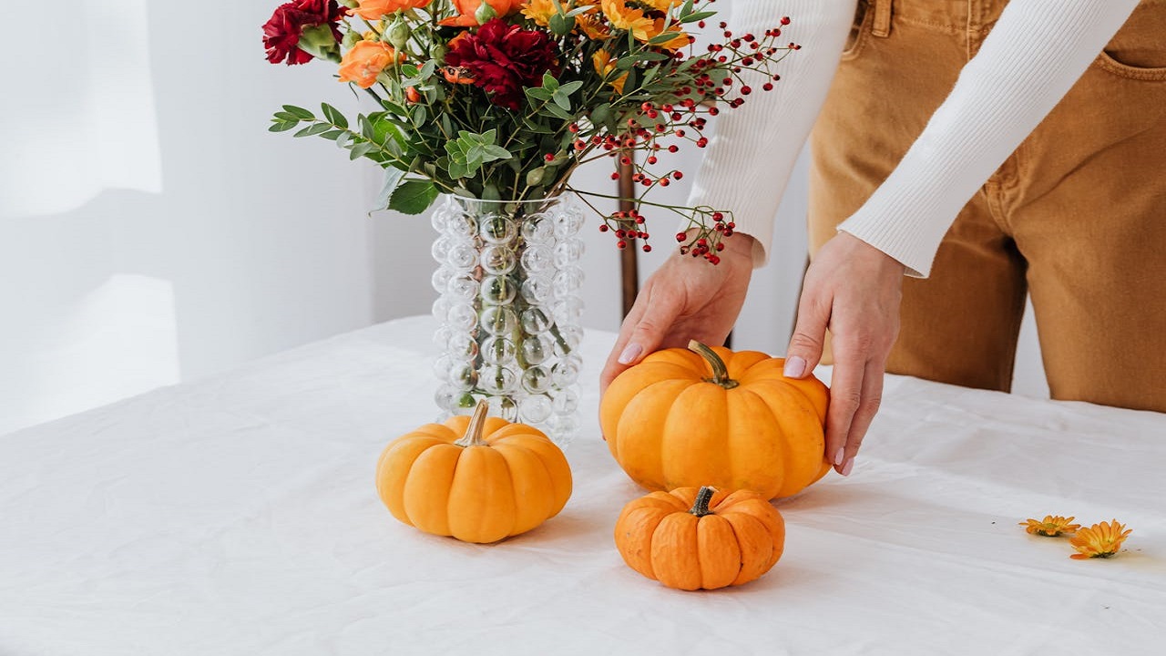 Faux pumpkins on entryway table