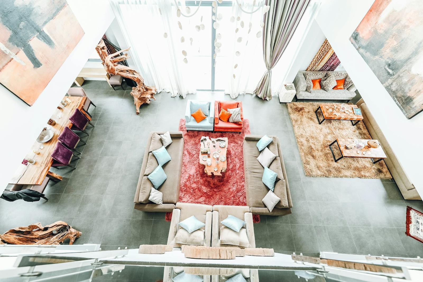 Bright, spacious living room with contemporary design, featuring cozy sofas and vibrant decor elements.