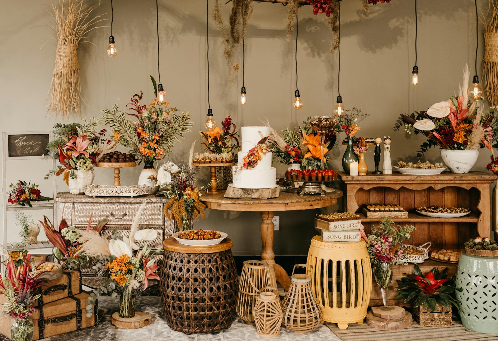 Beautiful rustic indoor decor with floral arrangements, baskets, and vintage elements.