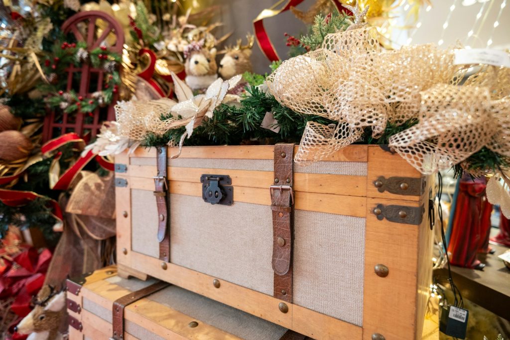 a wooden trunk with christmas decorations on top of it
