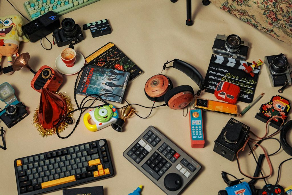 A table topped with lots of electronics and toys