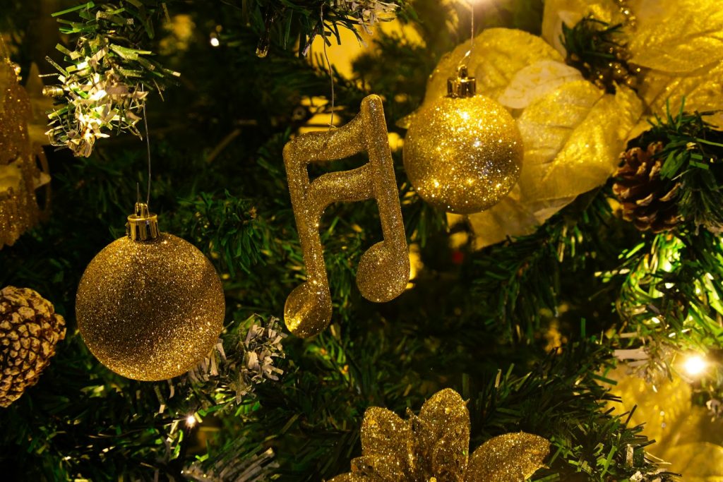 Golden musical note ornament on a christmas tree.