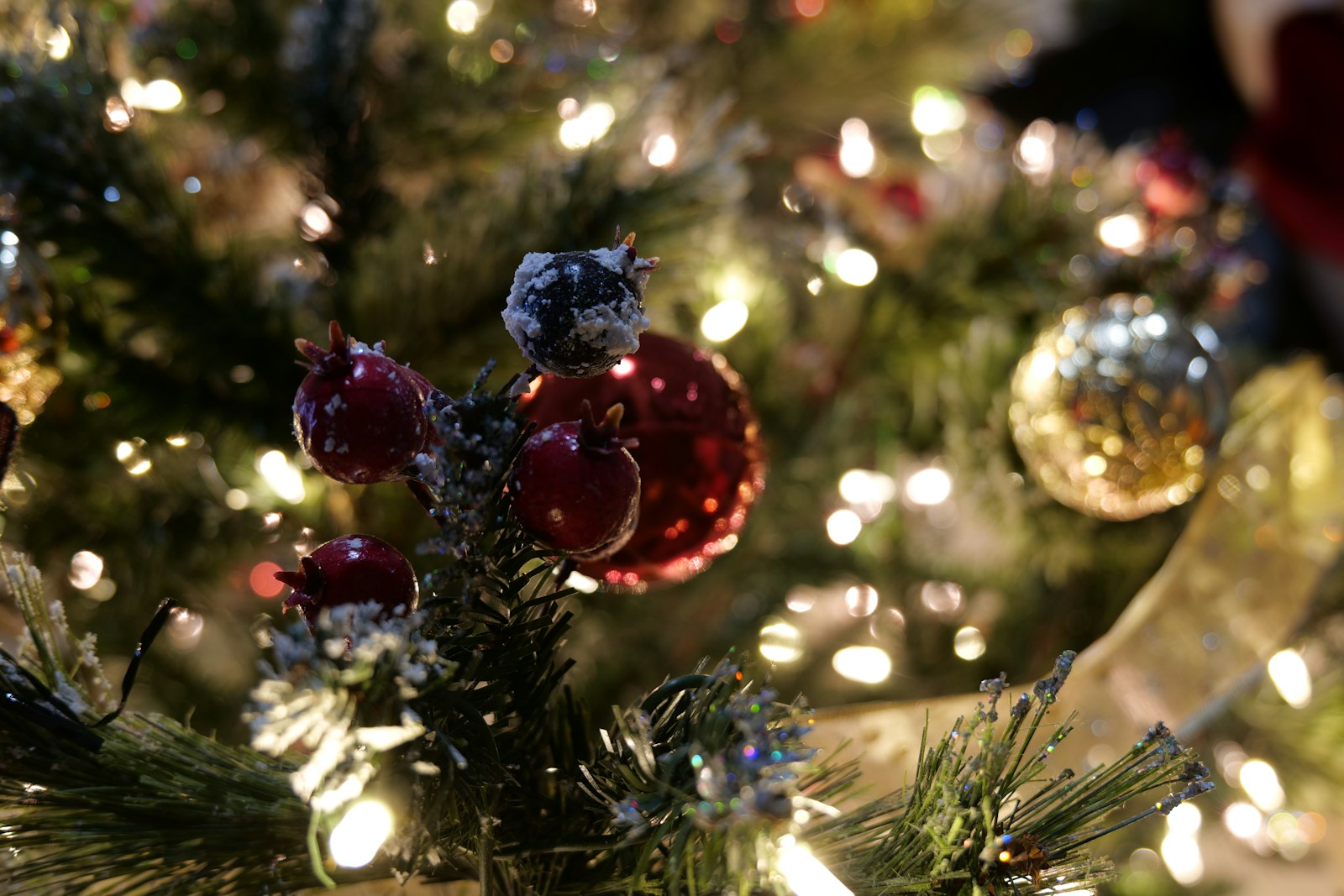 a close up of a christmas tree with ornaments