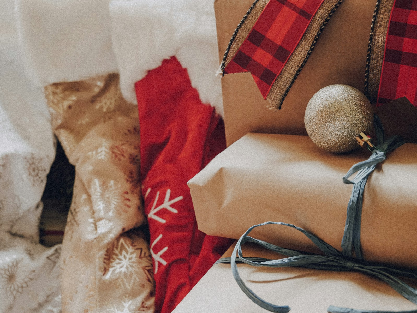 a pile of presents wrapped in brown paper