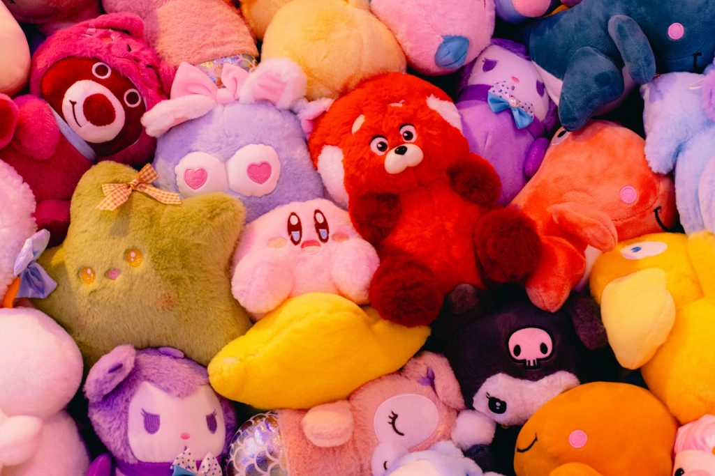 Plushies fill a cozy, colorful, and cute scene.