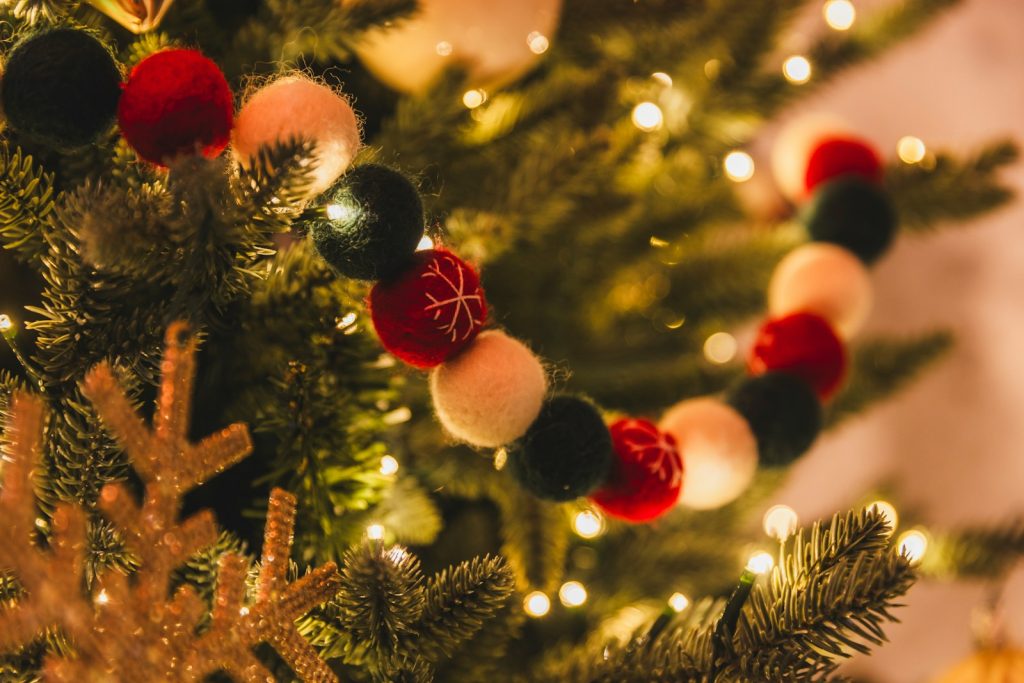 A close up of a christmas tree with ornaments on it