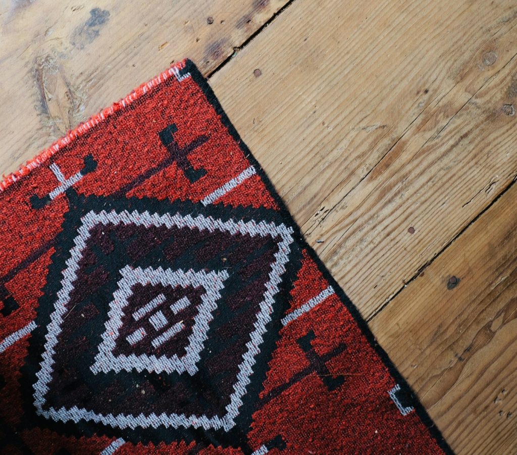 red, black, and white tribal print mat