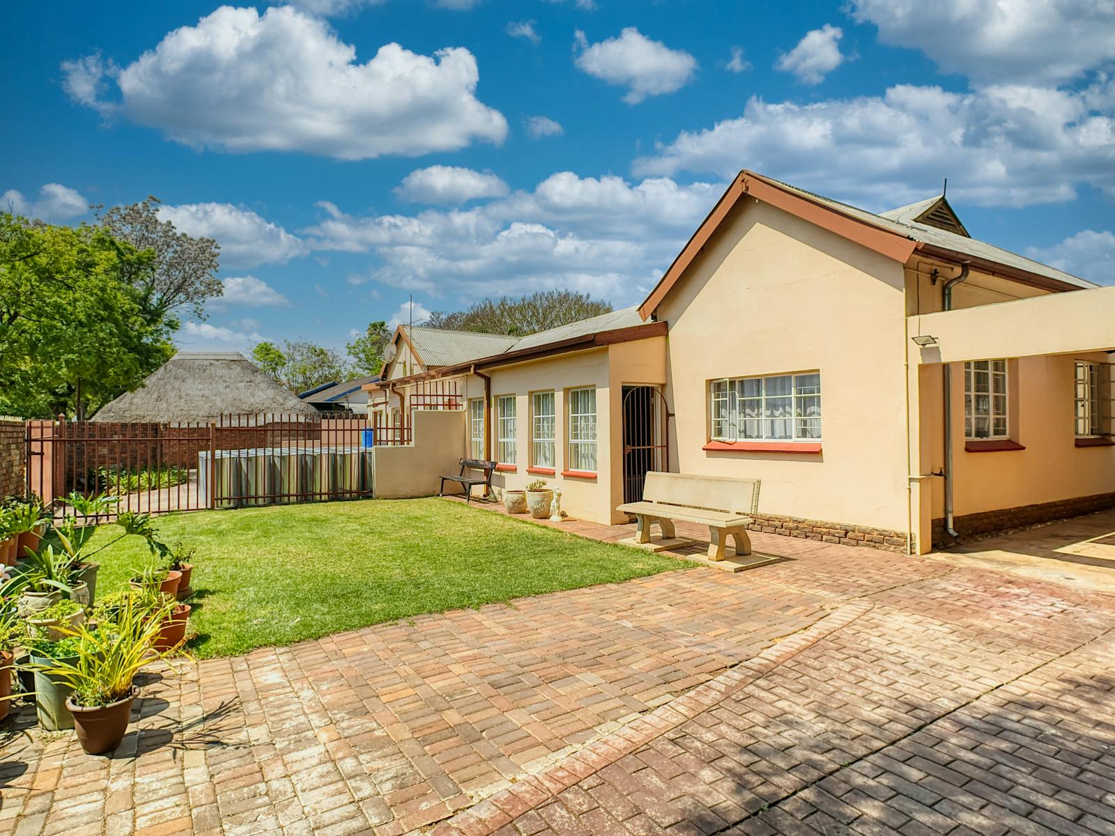 Cozy suburban house with a neat garden and driveway in Pretoria, South Africa.