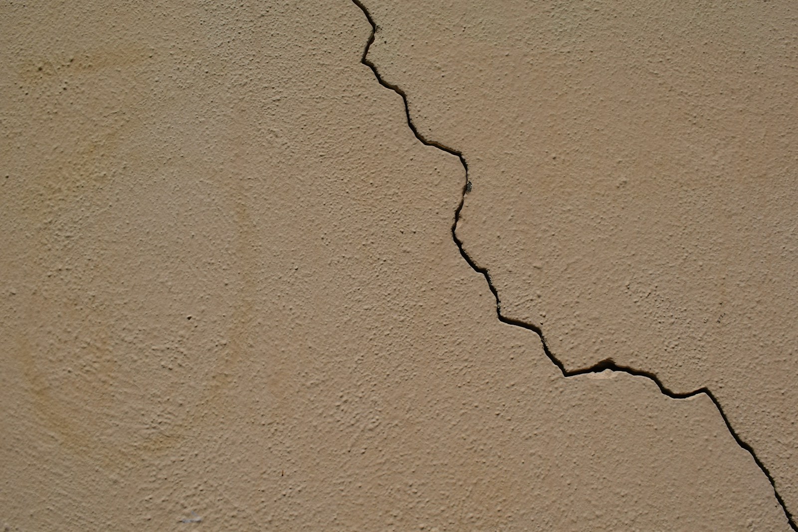 black coated wire on brown concrete wall