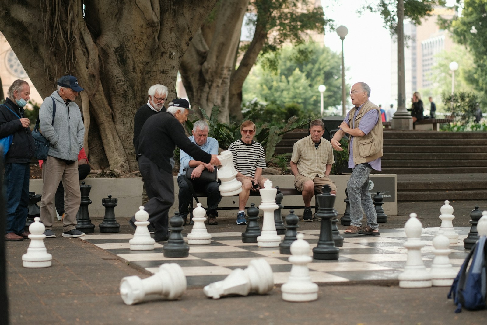 A group of people playing a game of chess