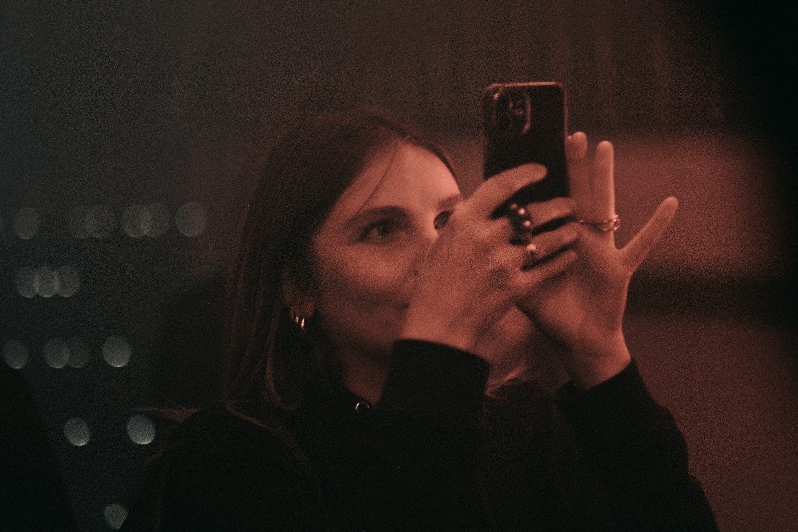 a woman taking a picture with her cell phone