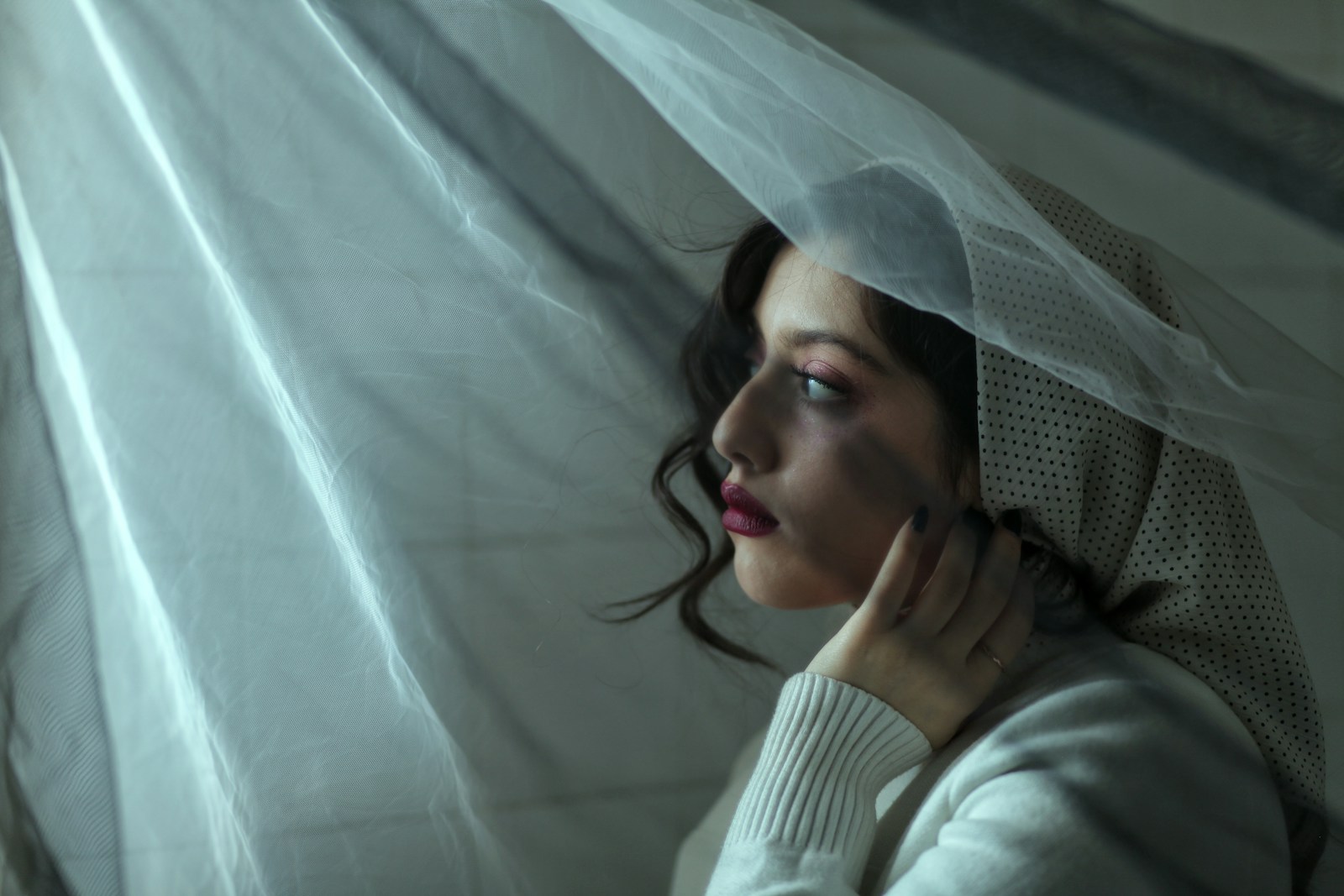 a woman with a veil over her head