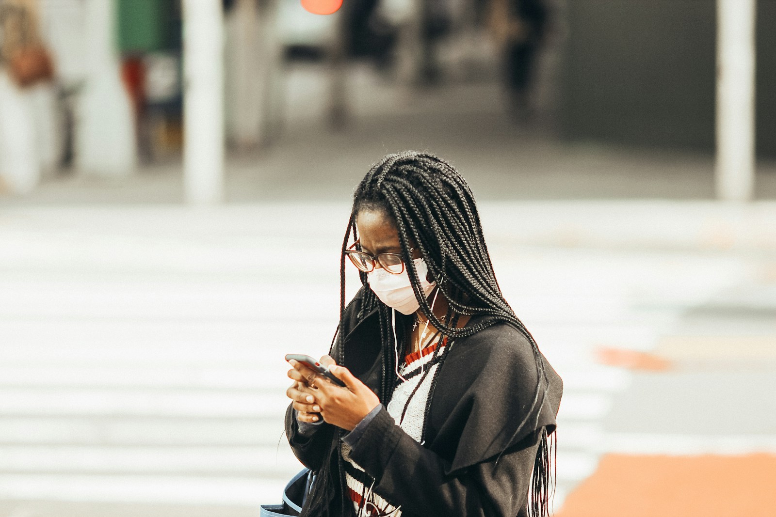 woman in black hijab covering face with black and white hijab