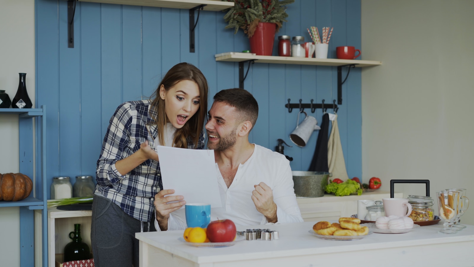 Couple reacting with excitement to a document