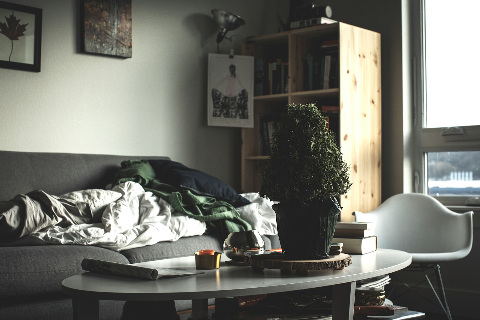 oval white wooden coffee table near vacant sofa