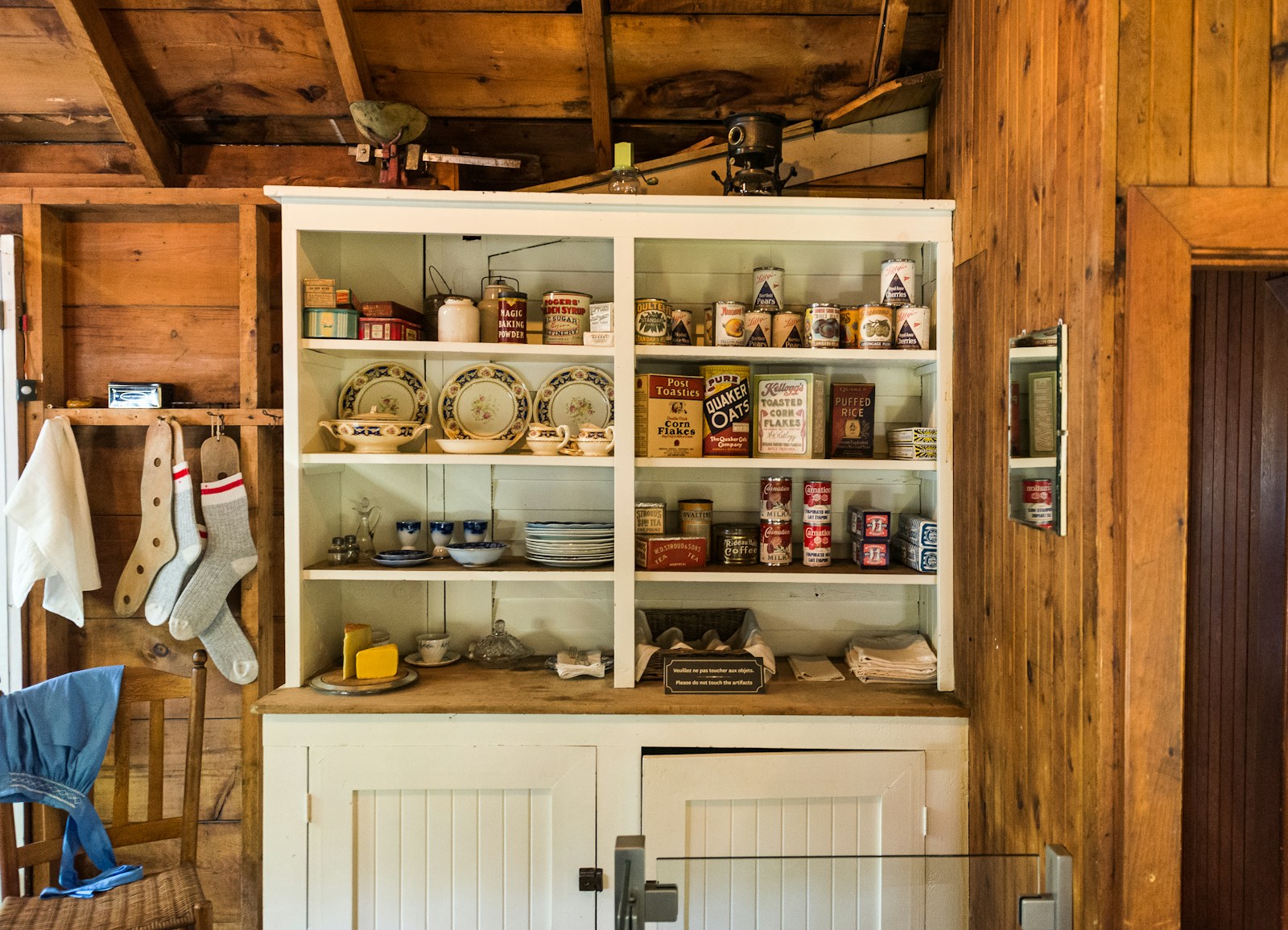 white ceramic mugs on brown wooden shelf