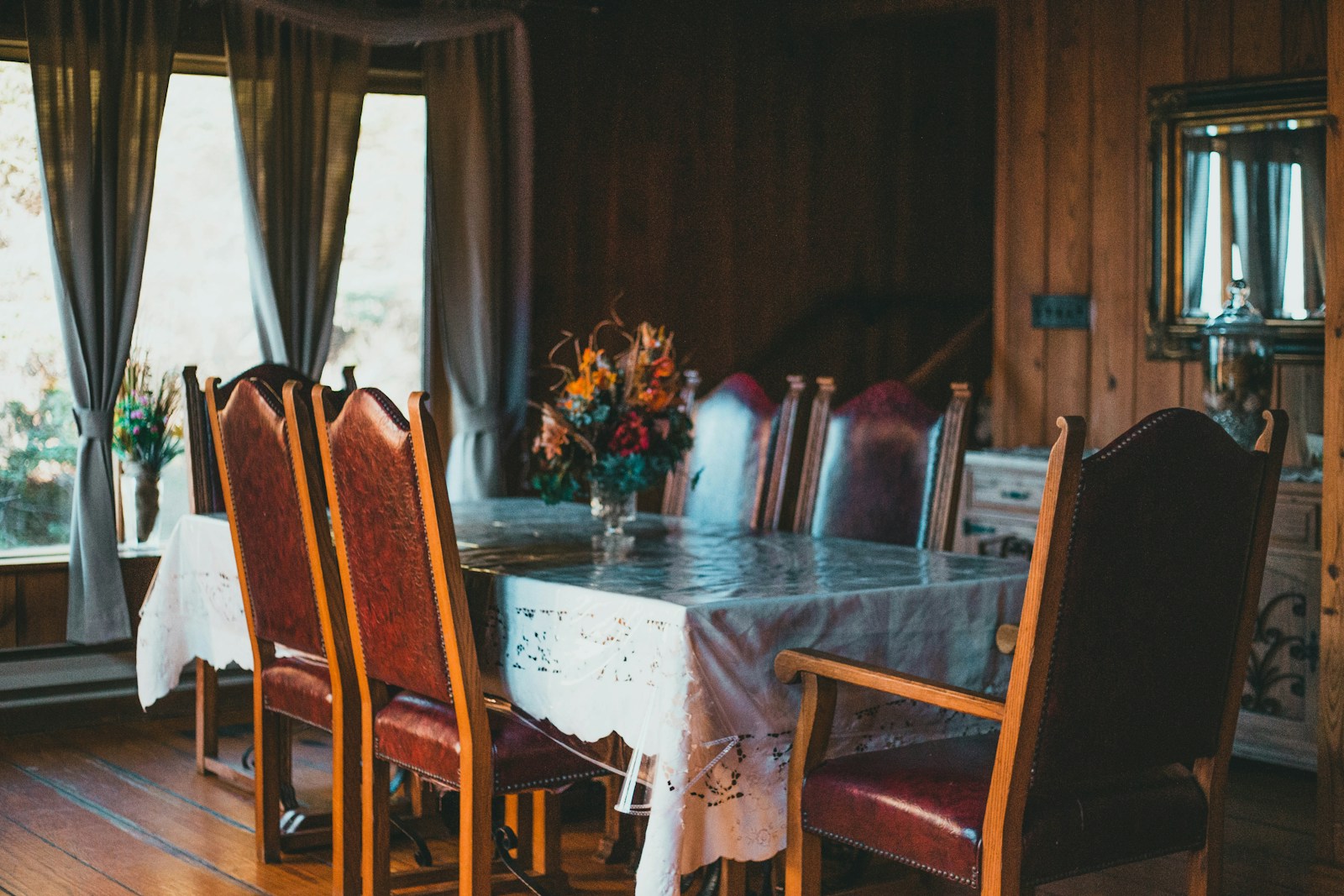 a dining room with a table and chairs