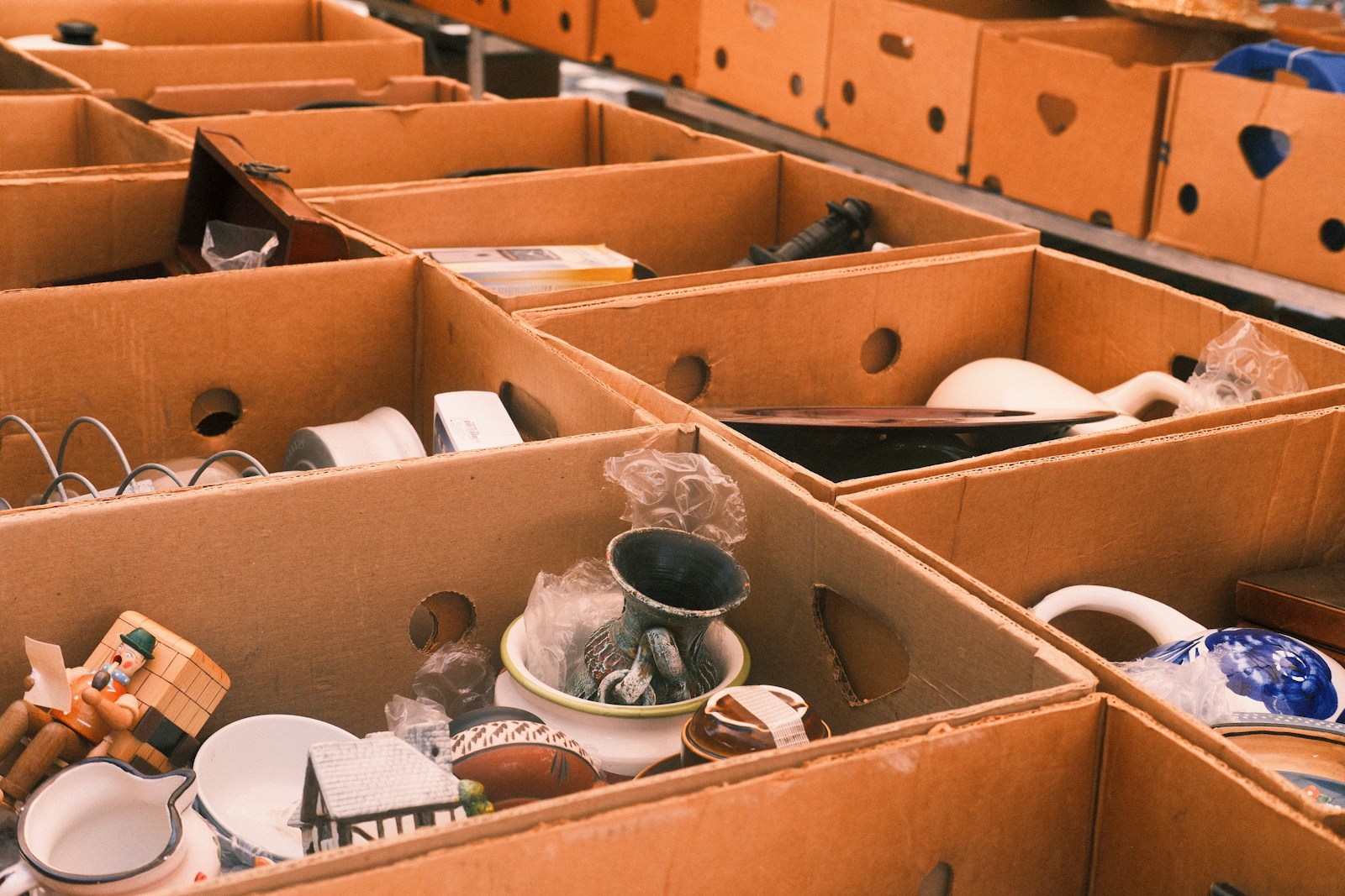 Boxes filled with various items are shown.