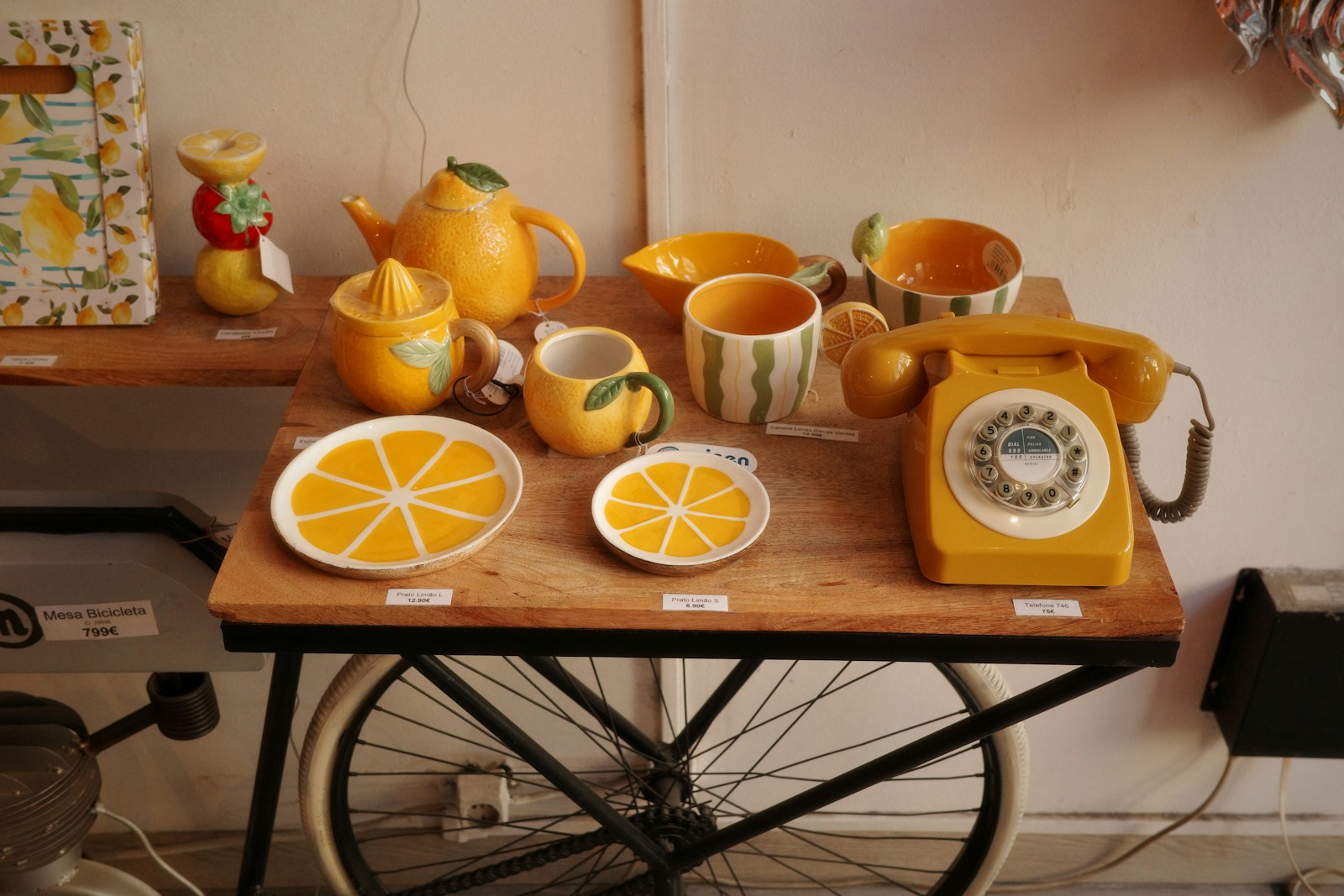 Yellow kitchenware and vintage phone display