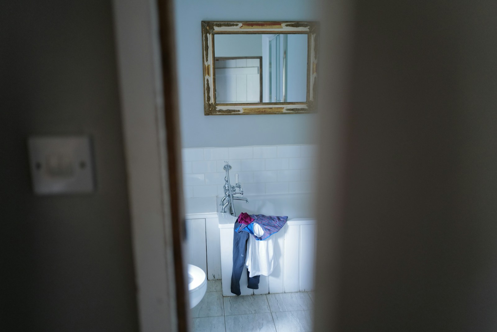 a bathroom with a mirror and a sink