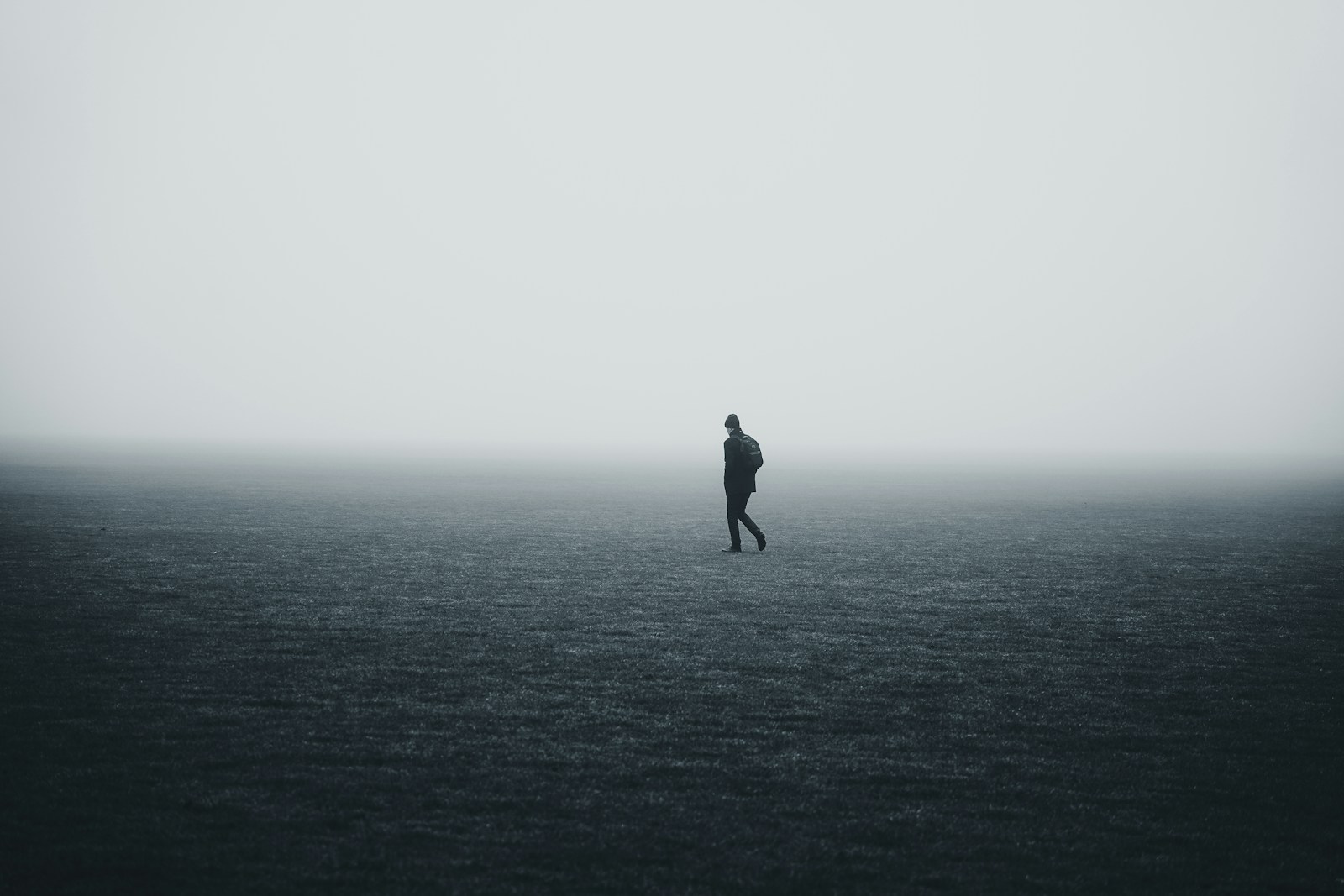 a person standing in the middle of a large body of water