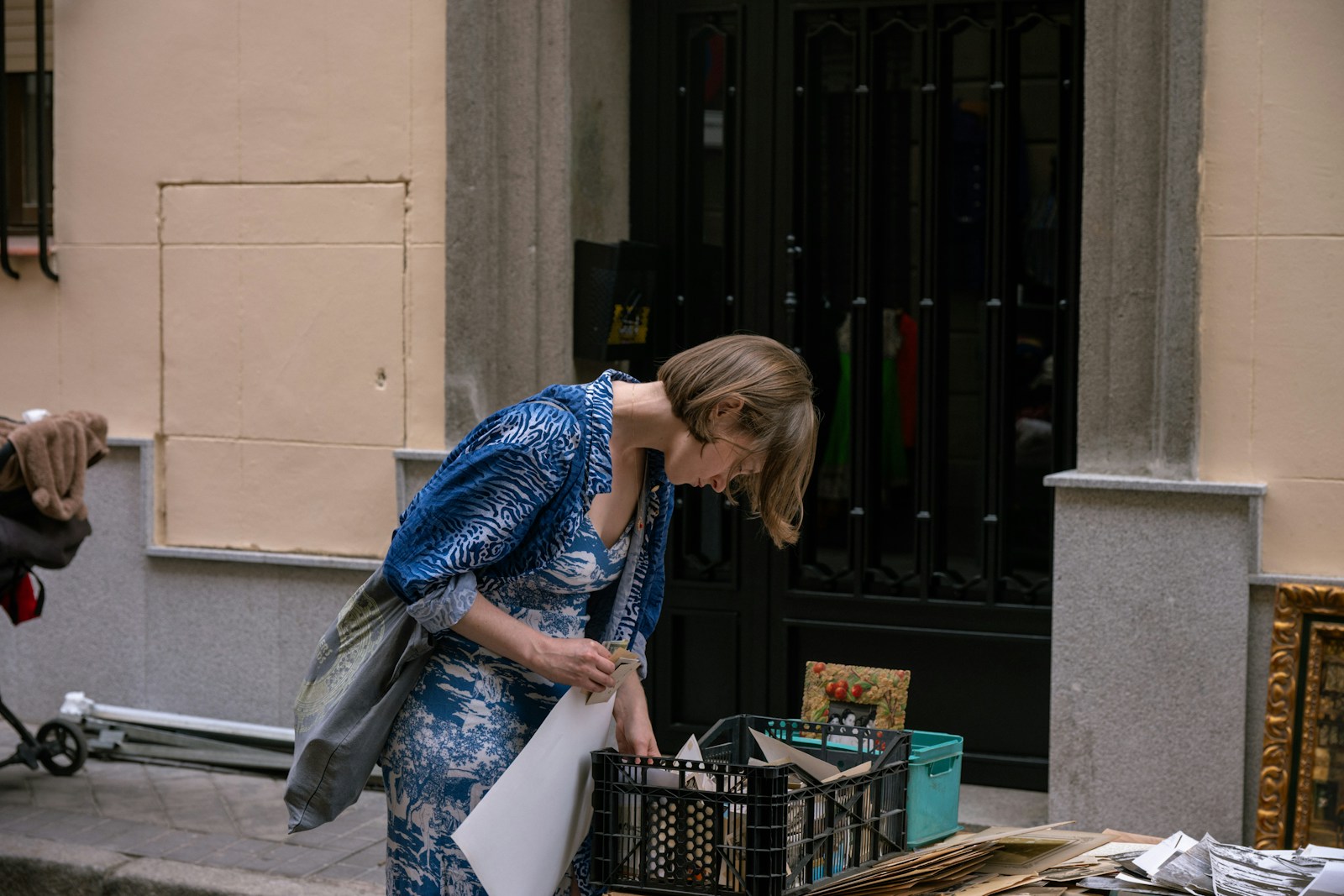 Woman browsing items at an outdoor market