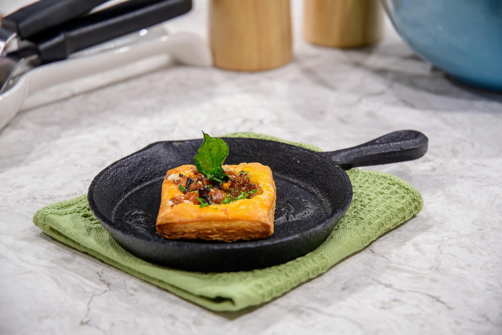 Delicious savory pastry on a skillet, perfect for gourmet snacking.