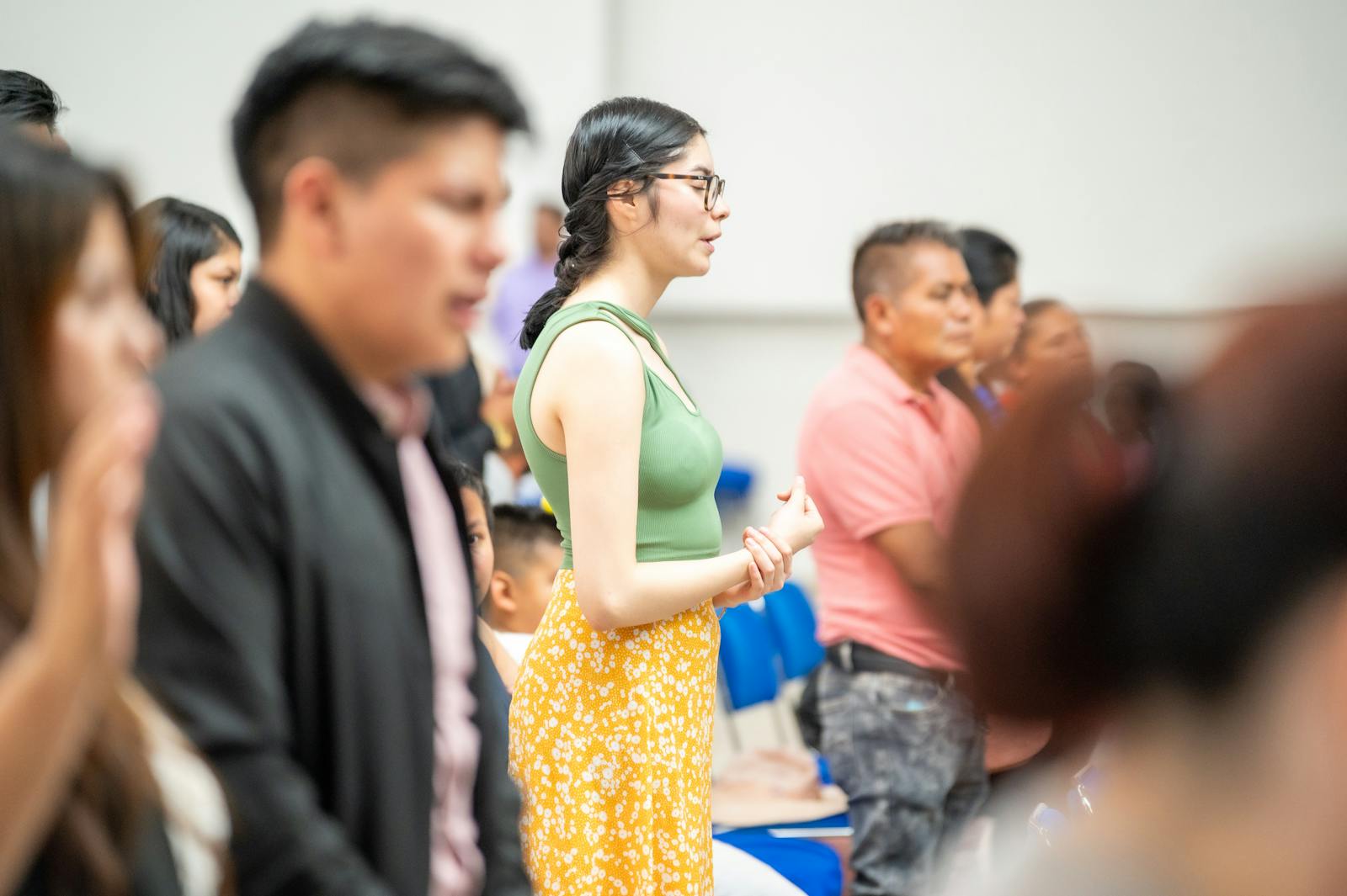 Group of people participating in a church service in Ciudad de México.