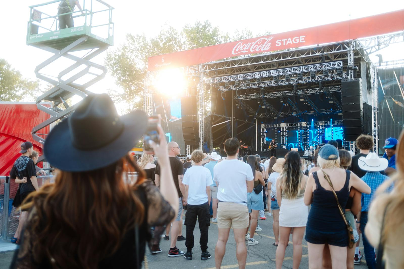 Crowd enjoying a live performance at an outdoor music festival.