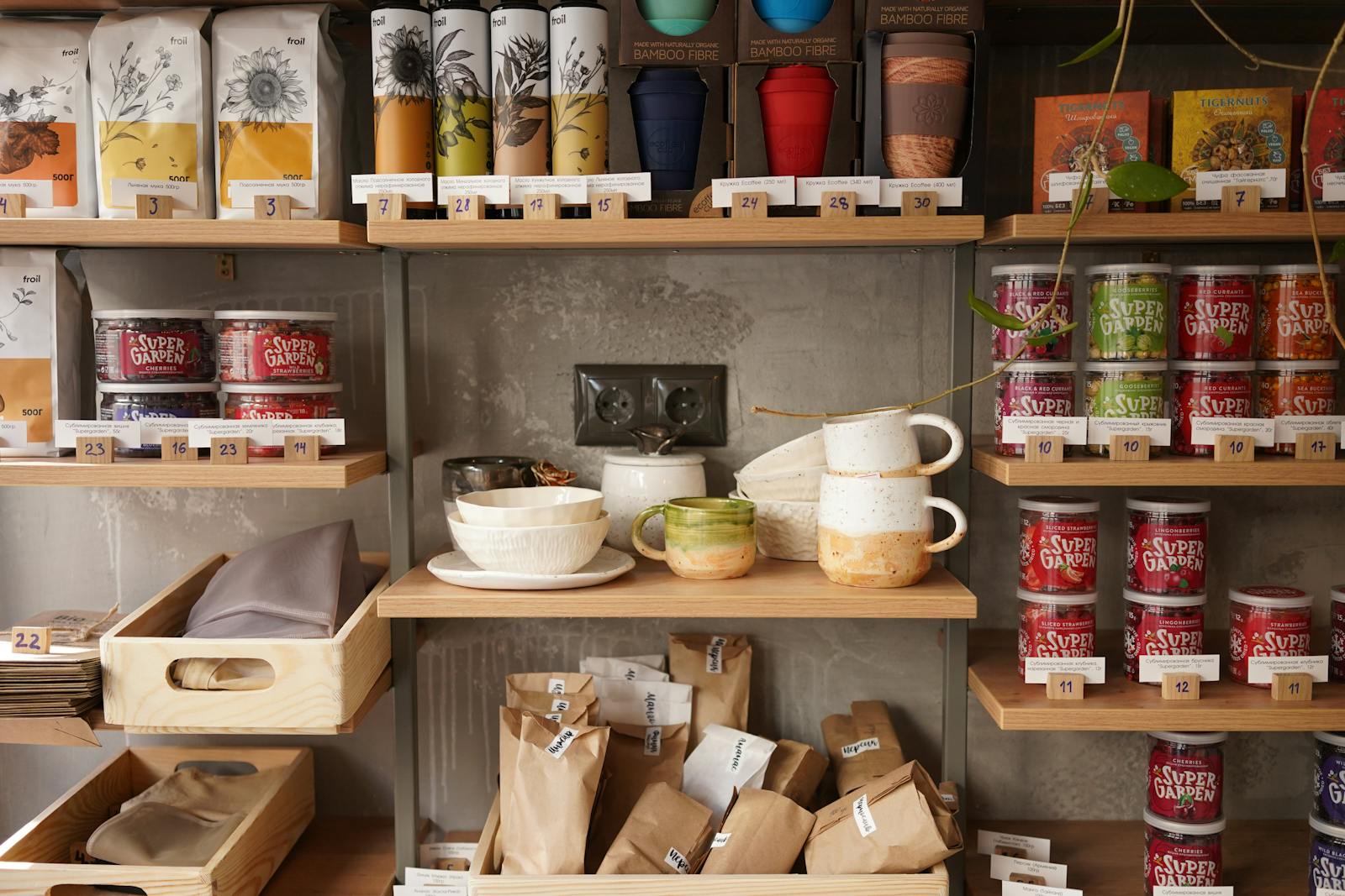 Rustic kitchen shelves displaying ceramics and food items, perfect for home decor inspiration.