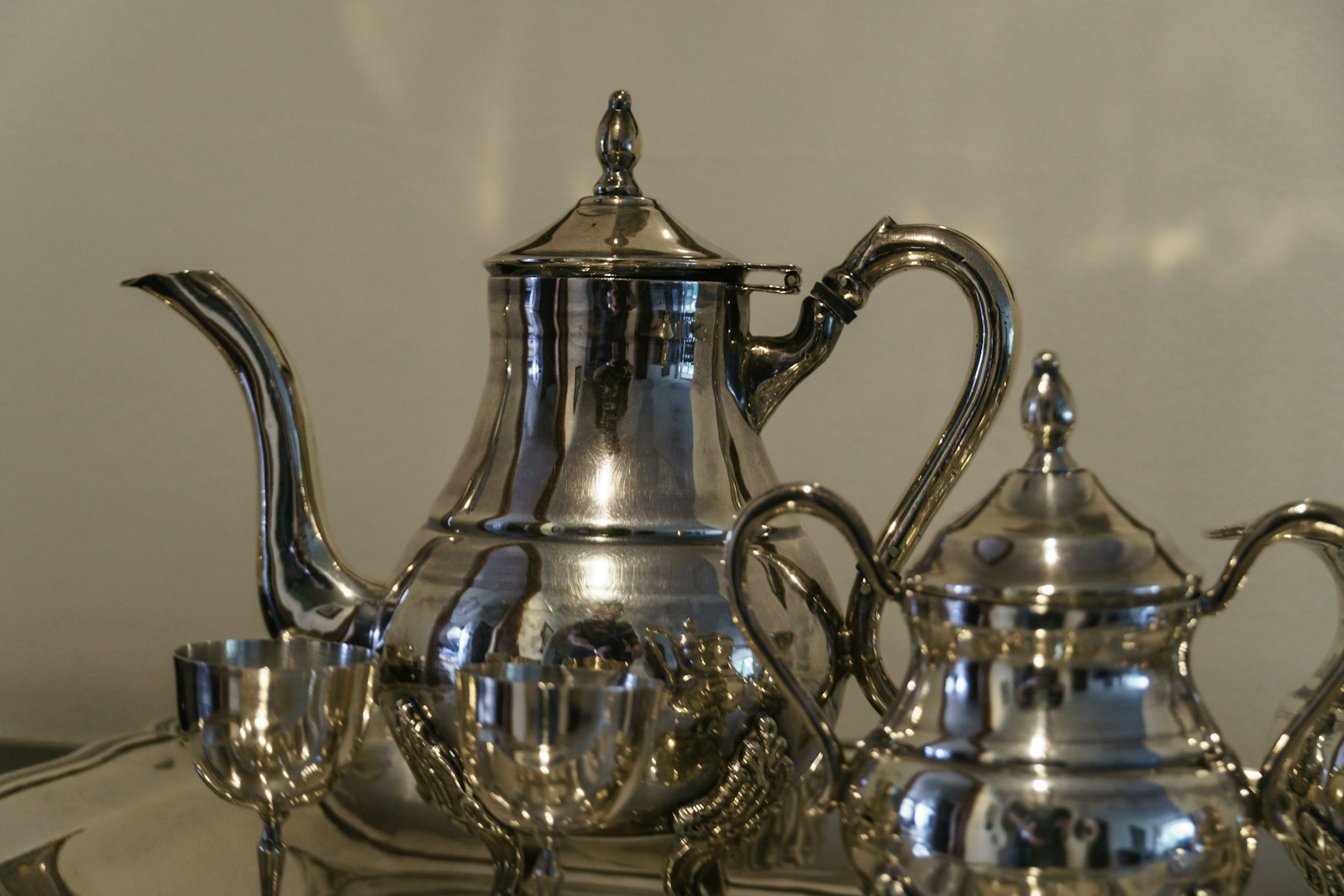 a tea kettle and glass