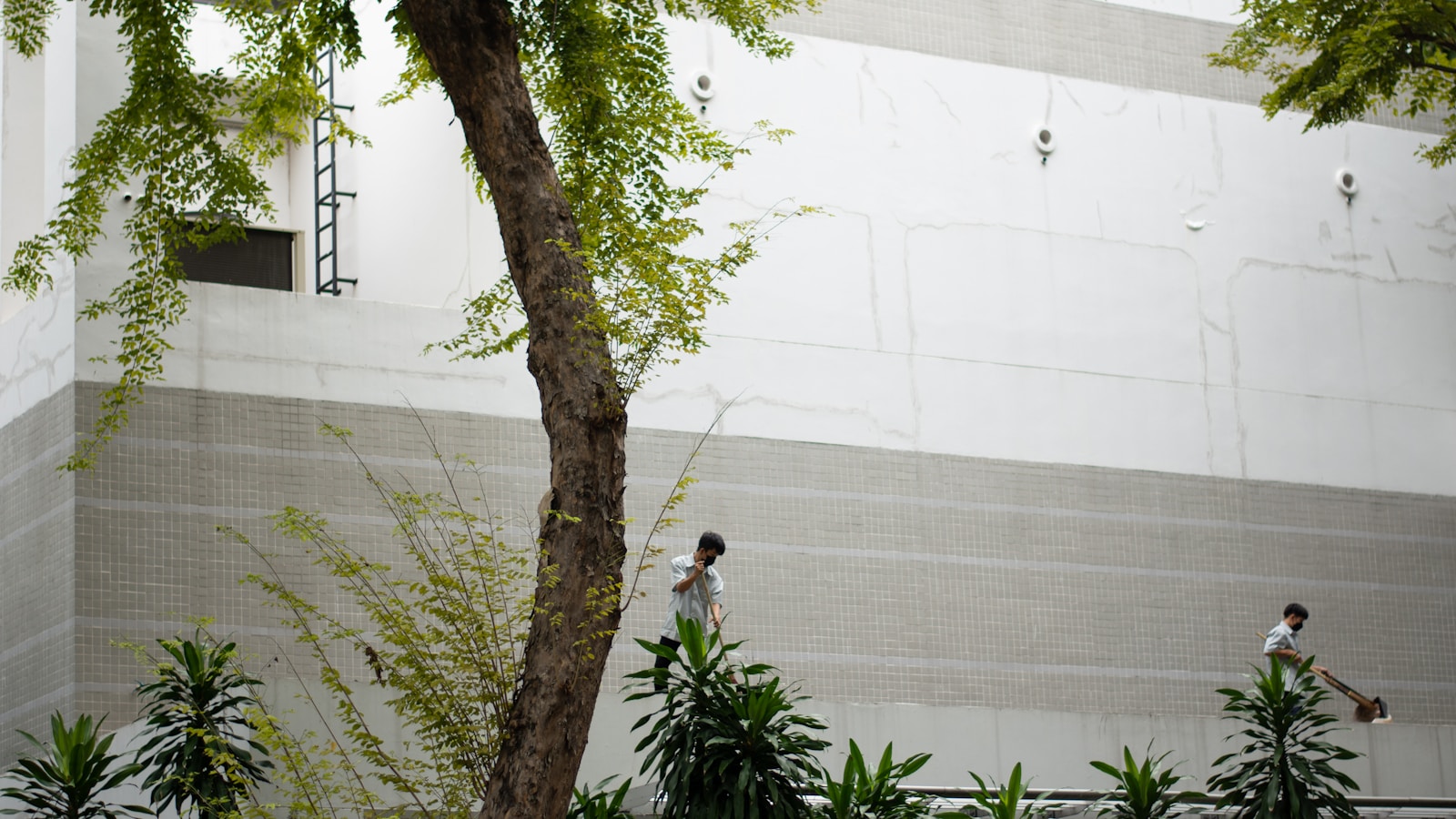 a few people standing in front of a building