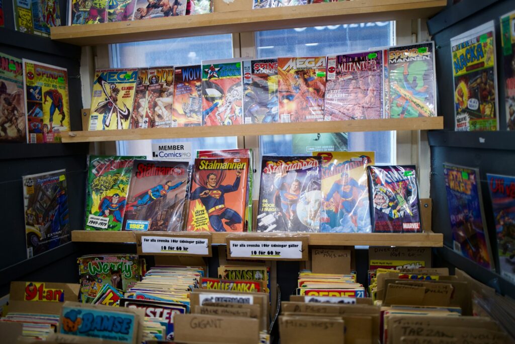 assorted books on brown wooden shelf