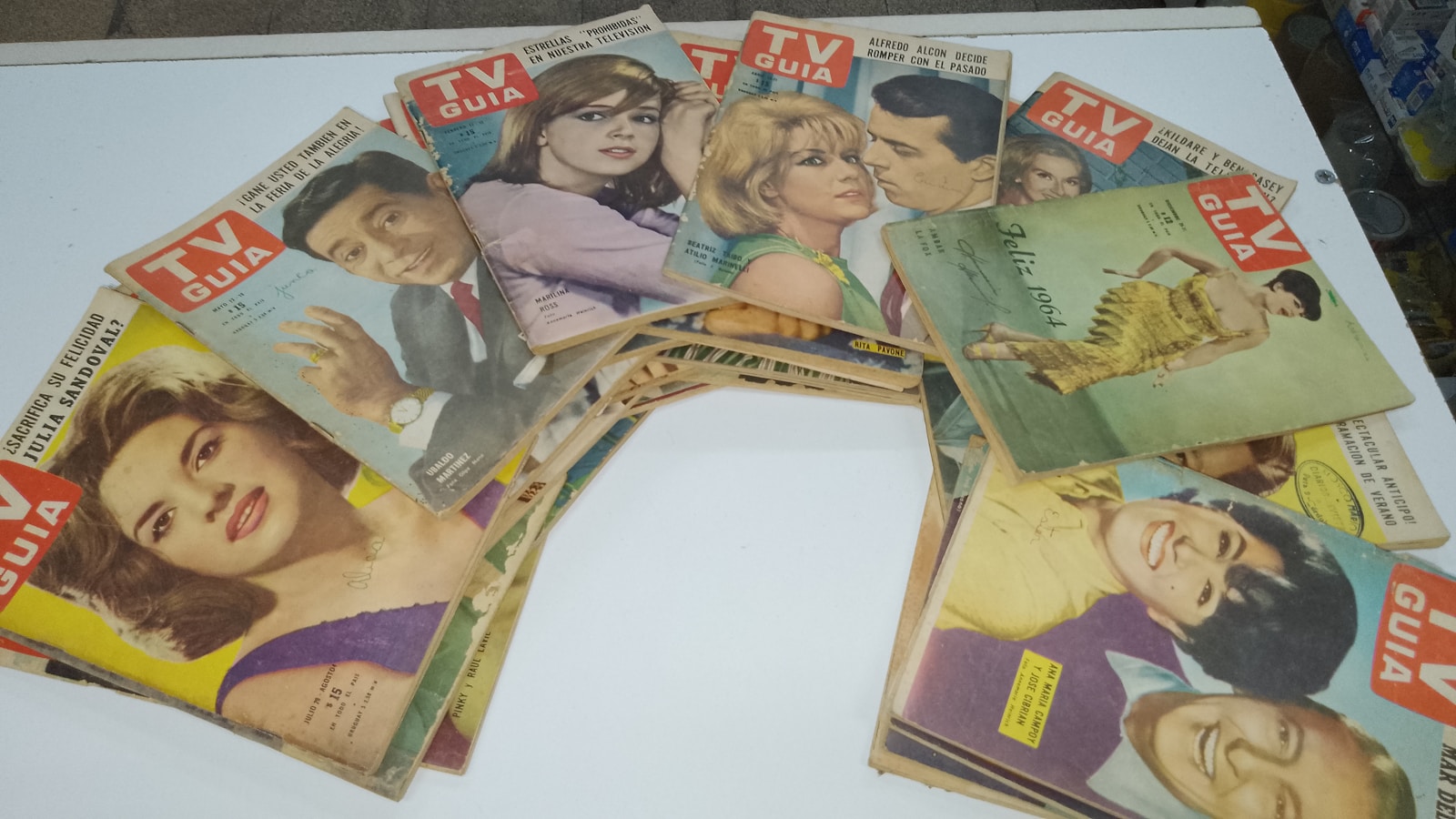 a bunch of magazines sitting on top of a table