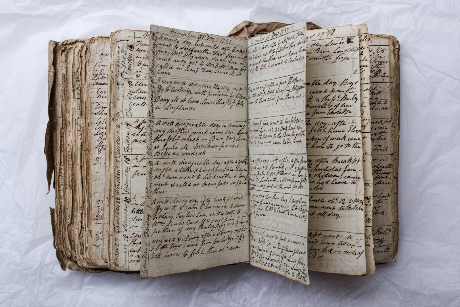 An old, handwritten book is open to view.