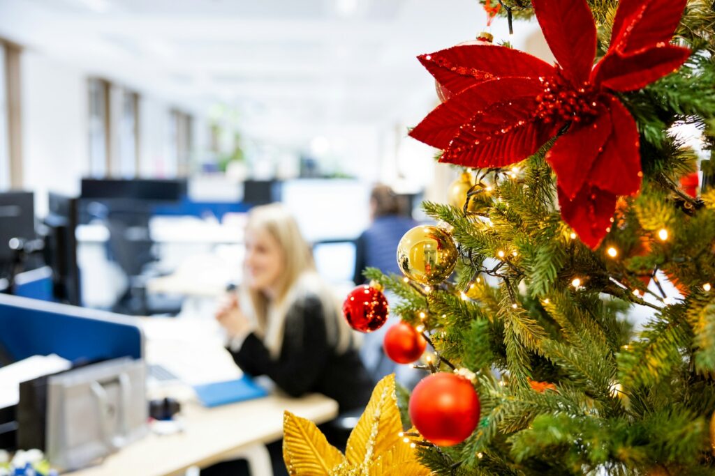 A decorated christmas tree in an office cubicle