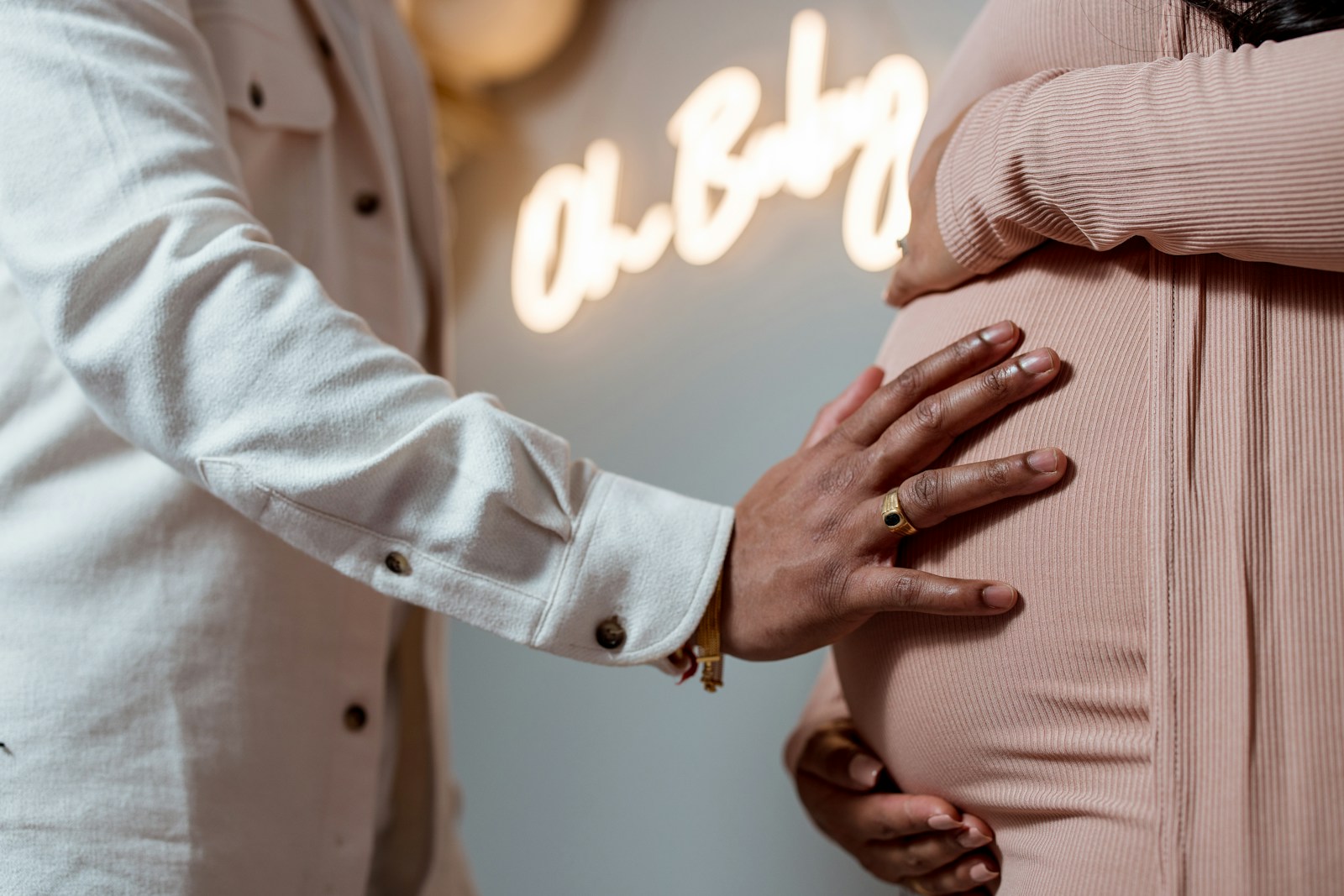 a pregnant woman's belly being examined by a doctor
