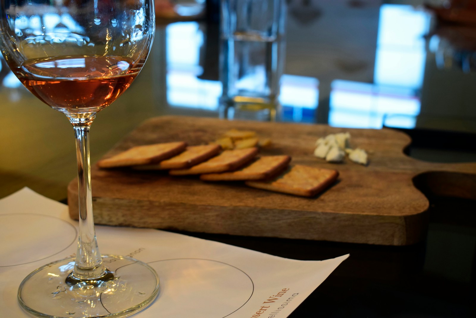 clear wine glass on white paper