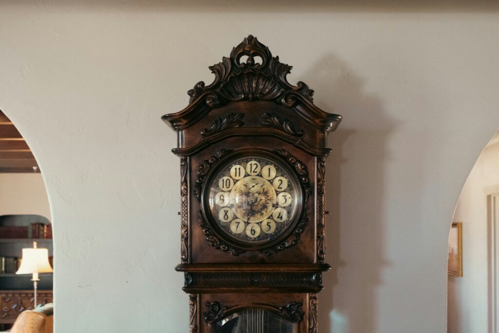 A grandfather clock sitting on top of a table
