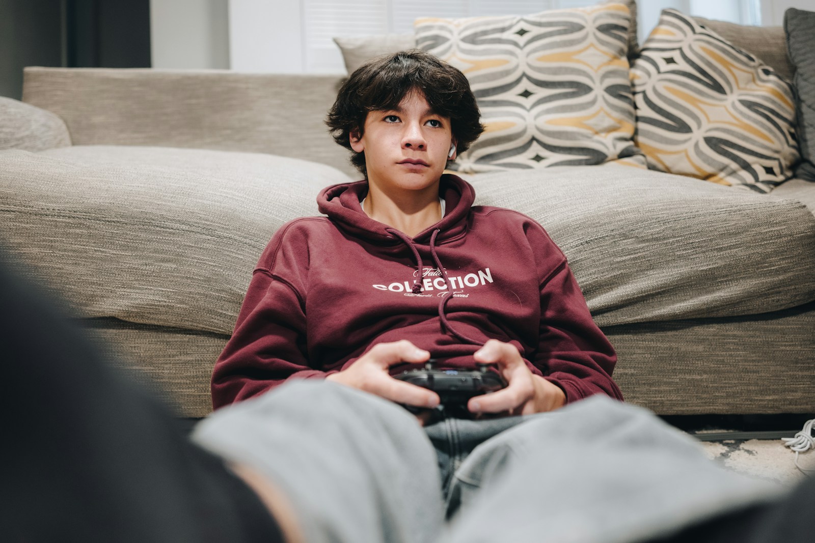 A young boy is playing a video game.
