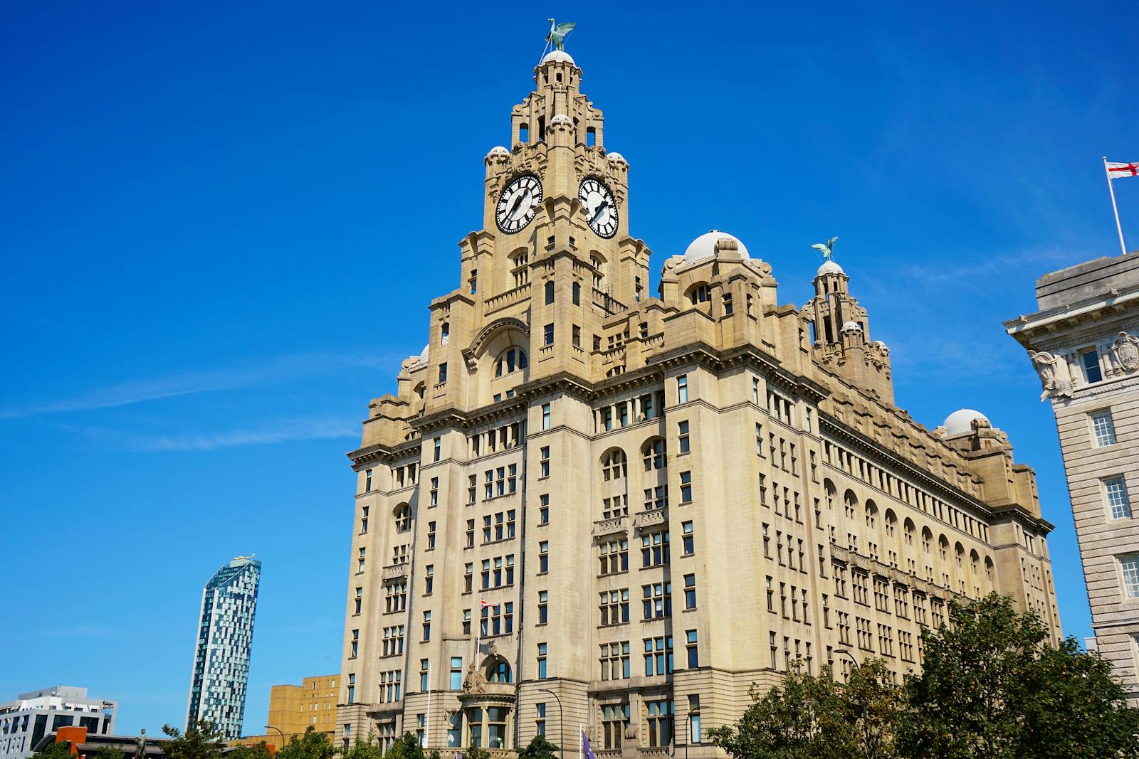 The Royal Liver Building under a clear blue sky in Liverpool, England.