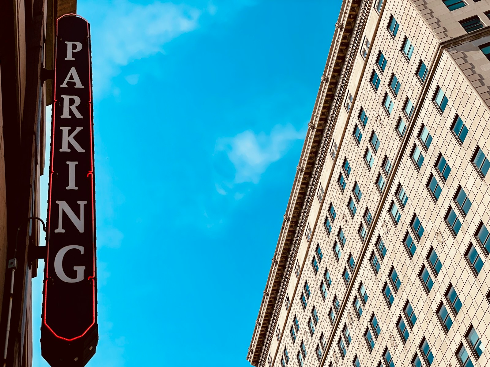 a tall building with a sign in front of it