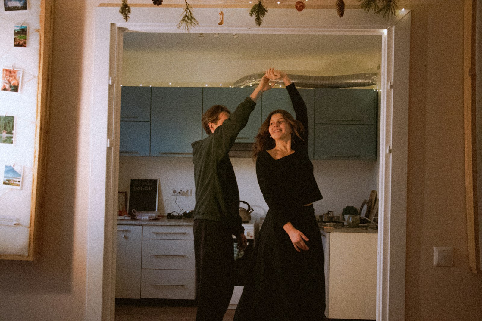 Couple dancing in a kitchen doorway