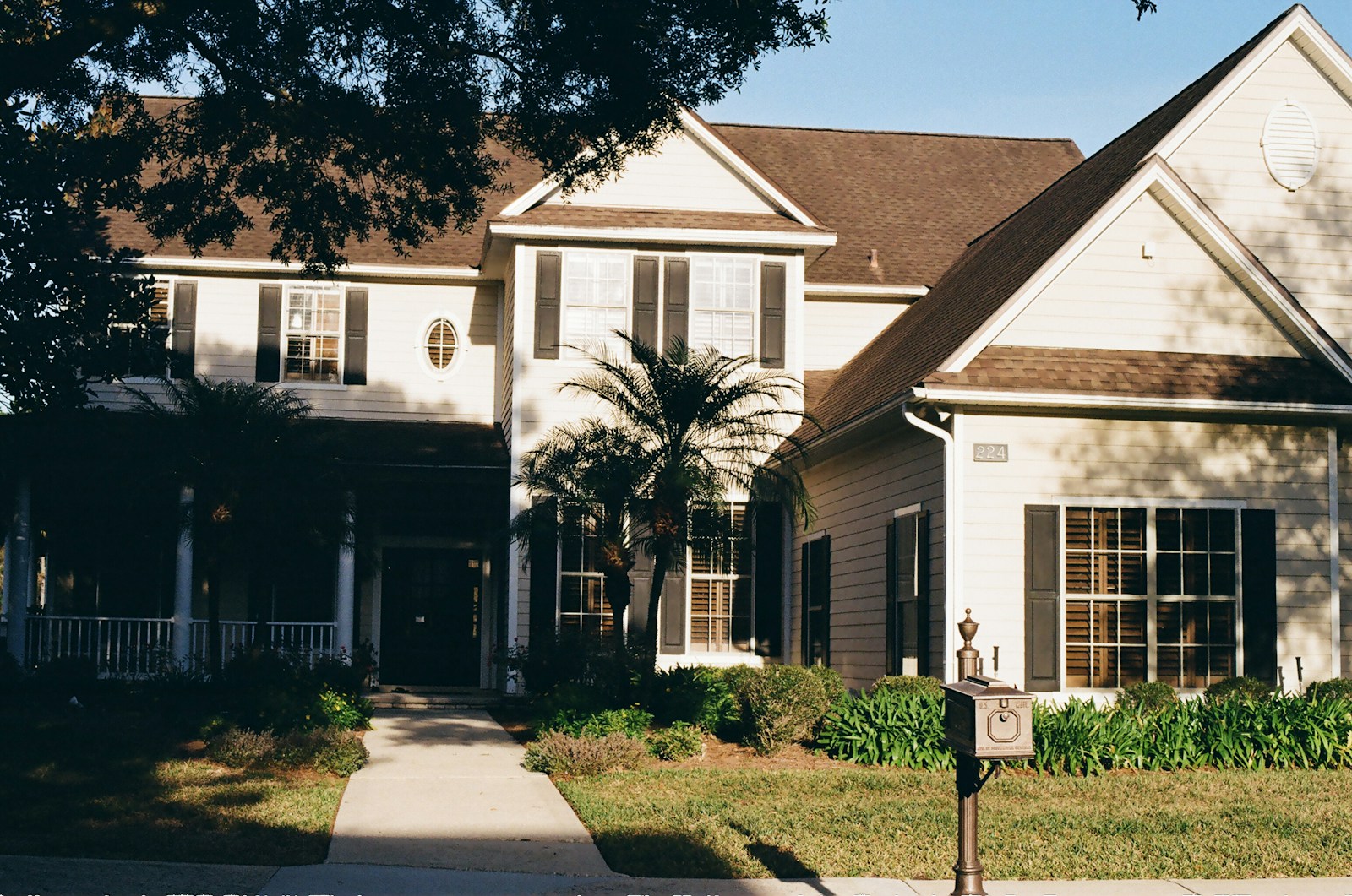 A large, two-story house with a covered porch.