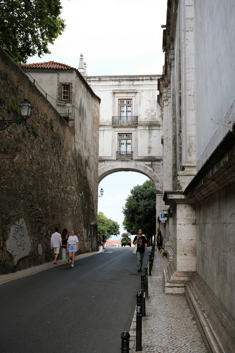 Arched passage over a street with people walking