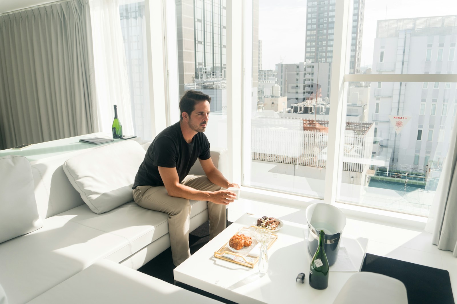 A man sitting on a couch in a living room