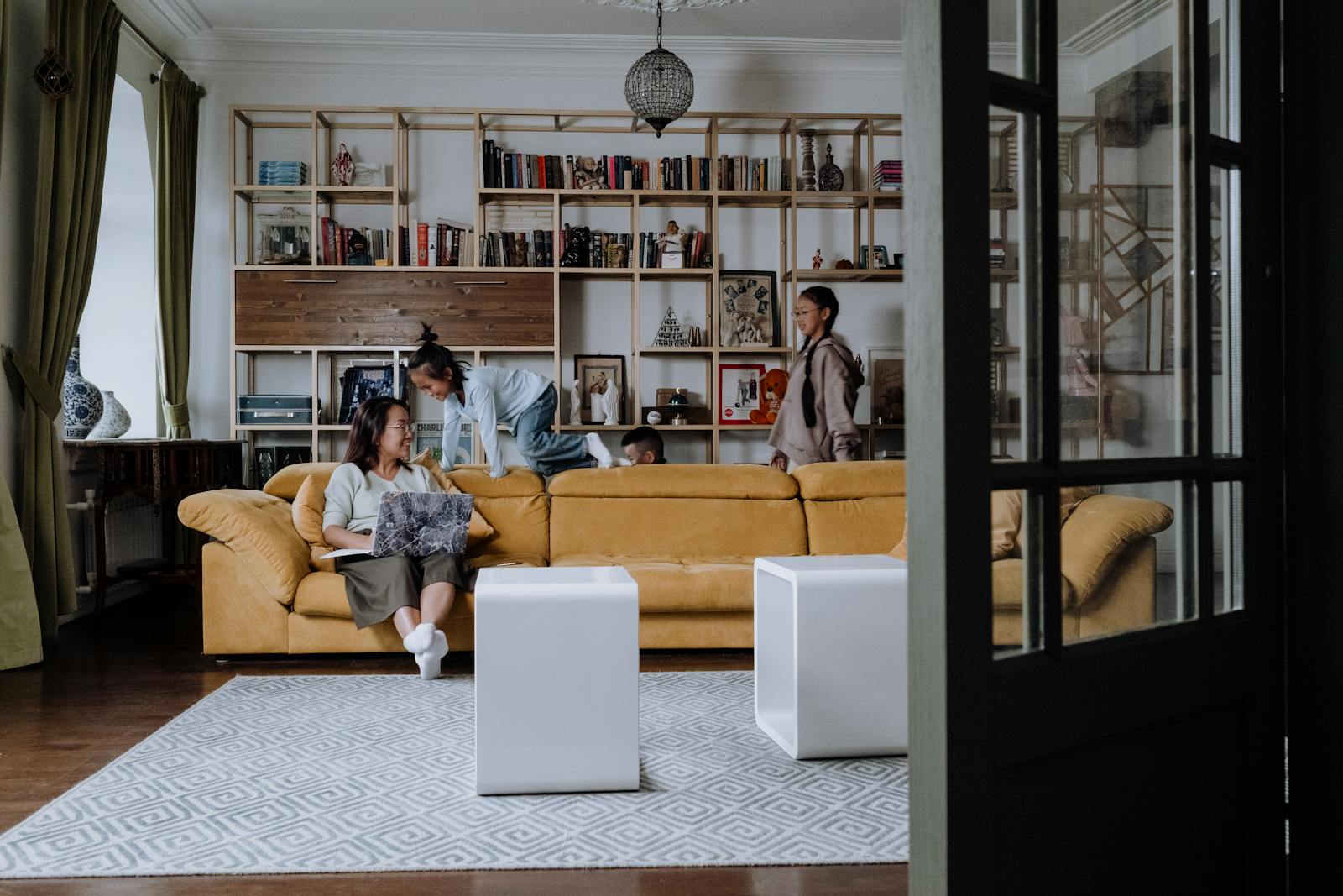 A family enjoying quality time together in a cozy and modern living room setting.