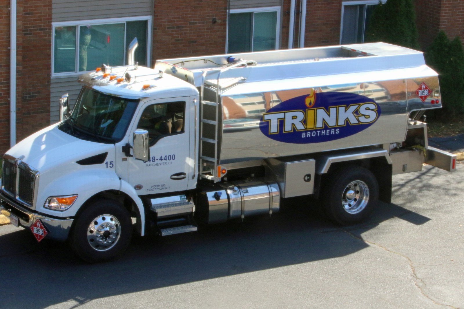 A truck parked in front of a building