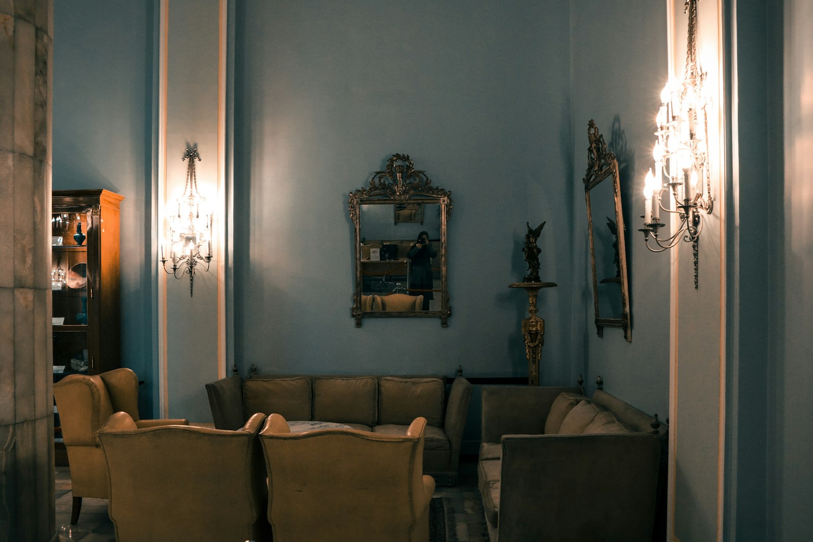 a living room filled with furniture and a chandelier